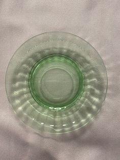 a glass plate sitting on top of a white cloth