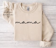 *SIZE GUIDE + MEASUREMENTS + COLORS are included in the listing photos. *ADDITIONAL SIZES + COLORS + STYLES (V-Neck, Hoodie, etc) are available upon request. Elevate your everyday look with our Custom Mother's Day Mama Shirt with personalized names on one sleeve or two if preferred.  Made from a breathable, luxuriously soft fabric with just the right amount of stretch. Featuring a crewneck style and a relaxed fit for a comfort that goes everywhere with you. The perfect essential or gift. T-SHIRT Needle Pouch, Grandma Sweatshirt, Mama Sweater, Grandma Sweater, Mom Sweater, Mama T Shirt, New Grandma, Twin Mom, Personalized Grandma