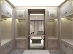 an empty walk - in closet with white walls and beige drawers on the bottom floor