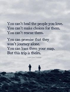 two people standing on top of a hill next to each other with the words you can't heal the people you love