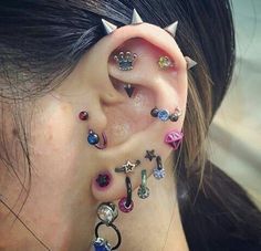 a woman with some piercings on her ear