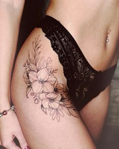 a woman's thigh with flowers on it