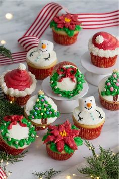 christmas cupcakes decorated with icing and decorations