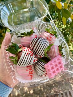 chocolate covered strawberries with sprinkles in a plastic container