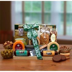 the gourmet gift basket includes crackers, nuts, cheese and other snacks