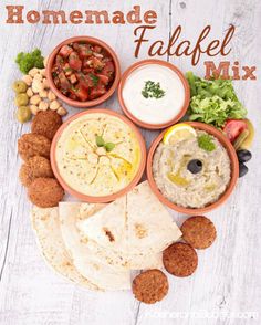 homemade falafel mix with pita breads, olives and tomatoes