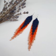 Navy blue orange beaded earrings Seed bead earrings Chandelier | Etsy Handmade Orange Beaded Earrings As Gift, Handmade Bohemian Long Drop Tassel Earrings, Handmade Long Drop Bohemian Tassel Earrings, Orange Beaded Fringe Dangle Earrings, Colorful Beaded Long Drop Tassel Earrings As Gift, Bohemian Beaded Fringe Chandelier Earrings As Gift, Bohemian Beaded Fringe Chandelier Earrings For Gift, Artisan Beaded Tassel Earrings As Gift, Artisan Beaded Tassel Earrings For Gift