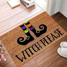 a door mat that says, witch please with two legs on the floor next to it