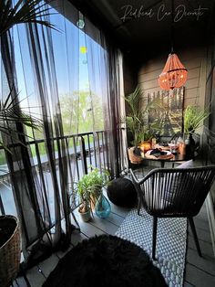 the balcony is decorated with plants and potted plants