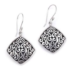 These sterling silver dangle earrings have an elegant curved diamond shape. Bali's Dewa Arimbawa handcrafts the pair with elaborate detailed scroll work. Sterling Silver Dangle Jewelry With Intricate Design, Classic Sterling Silver Diamond-shaped Jewelry, Classic Diamond-shaped Sterling Silver Jewelry, Formal Engraved Dangle Earrings, Nickel Free Silver Diamond-shaped Jewelry, Ornate Engraved Sterling Silver Earrings, Elegant Silver Earrings With Oxidized Finish, Elegant Engraved Drop Earrings, Elegant Engraved Dangle Earrings