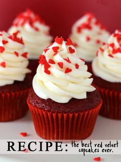 red velvet cupcakes with white frosting and sprinkles on top