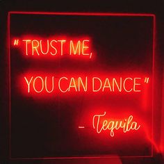 a neon sign that says trust me, you can dance tequila