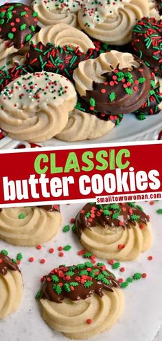 cookies with frosting and sprinkles are on a white platter next to a red sign that says classic butter cookies