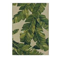 a rug with green leaves on it