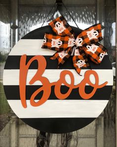 a halloween door hanger with boo on it