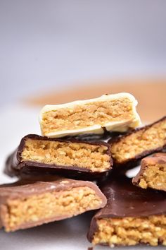 chocolate and peanut butter bars stacked on top of each other