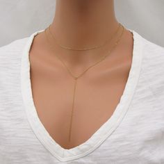 REAL GOLD-FILLED NECKLACE SET This lariat necklace set is made with all gold-filled parts (not plated) so it will be durable and tarnish resistant. Includes both necklaces pictured - can be worn together or separately. The drop chain of the lariat measures approximately 4 inches long. Please leave a note at checkout if you want this changed. Both necklaces close with a spring-ring clasp. Sterling silver version here: www.etsy.com/listing/763096037/sterling-silver-lariat-necklace-layering SIZING - PLEASE READ: Note that necklaces will fit differently depending on a person's size. Please measure. ABOUT GOLD FILLED JEWELRY: This quality piece is made with real gold filled, not plated. Gold-filled jewelry has 100x more gold alloy than gold plated and because that layer is so much thicker, it m Gold-tone Lariat Jewelry As A Gift, Gold-plated Dangle Lariat Necklace, Gold-tone Lariat Necklace Gold Plated, Gold Dangle Lariat Necklace With Adjustable Chain, Dainty Adjustable Gold-tone Lariat Necklace, Gold Plated Lariat Necklace With Gold Chain, Gold Lariat Necklace With Dangle Clavicle Chain, Gold-plated Lariat Necklace With Gold Chain, Gold-tone Lariat Necklace With Clavicle Chain As Gift