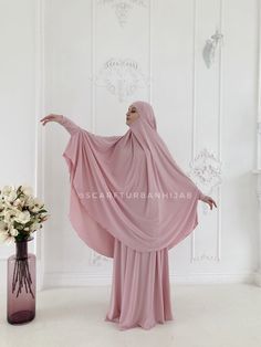 The original model of the traditional hijab - khimar, which is a single movement can become a niqab. You just need to lift hijab from his chin and closes face. Lovely blush pink color is so elegant , it looks modesty and innocent, elegant and stylish. This model burkas have a cuff that will make your hijab is not only very beautiful but also convenient for daily use. This handy headdress like those who do not yet know how to wind a scarf, busy mums and female students. It is simple and concise, Pink Khimar, Khimar Niqab, Islamic Clothing Abayas, Muslim Dress Abaya, Long Hijab, Dress Abaya, Muslim Wedding Dresses, Wedding Muslim, Cloth Design