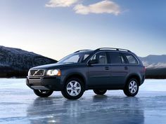 a volvo suv is parked on the ice