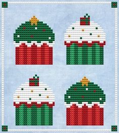 cross stitch christmas cupcakes on a blue background