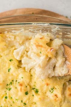 a casserole dish with mashed potatoes and parsley