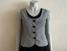 "Women's Vest Grey Vest Gray Women Vest Steampunk Waistcoat Formal Fitted Waistcoat Classic   Measurements (lying flat): Length(back): 20\"/ 51 cm Pit to pit: 17\"/ 43 cm Waist: 14 1/4\"/ 36 cm Please check measurements to insure a proper fit. Remember to allow yourself some extra room for movement. You can compare these with something from your closet that fits you well. Condition: great Vintage Condition N.B. Color may slightly differ from picture SHIPPING * I ship worldwide via Priority mail Affordable Gray Fitted Vest, Cheap Gray Vest Top, Fitted Punk Style Vest Outerwear, Punk Style Fitted Vest Outerwear, Punk Style Fitted Vest For Fall, Fitted Punk Winter Vest, Fitted Punk Style Winter Vest, Gothic Vest With Buttons For Fall, Gothic Button Vest For Fall