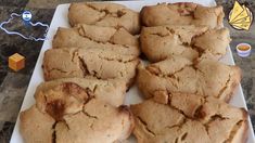 a white plate topped with cookies on top of a table