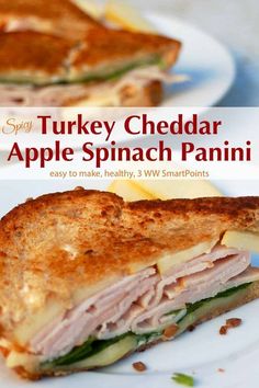 the turkey cheddar apple spinach panini is cut in half on a white plate