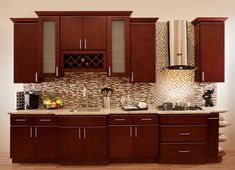 a kitchen with wooden cabinets and tile backsplash