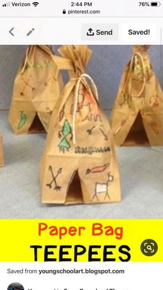 paper bag teepees are sitting on the floor next to each other with different designs