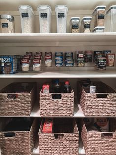 an organized pantry with baskets and food items