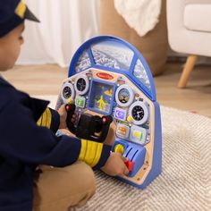 a little boy playing with a toy airplane