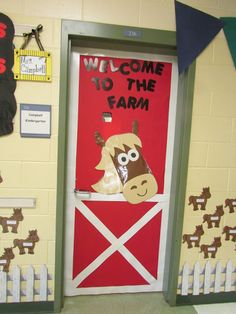 a door decorated with farm animals and the words welcome to the farm