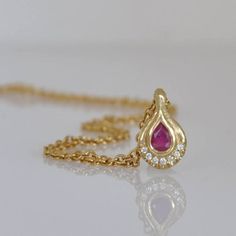 18k Gold Pendant with Ruby and Diamonds #diamondnecklace #GoldandRubynecklace #18kgoldnecklace #Handmadegoldjewelry Teardrop Diamond Necklace, Unique Gold Rings, Handmade Statement Necklace, Handmade Gold Jewellery, Infinity Pendant, 18k Gold Necklace, Solid Gold Necklace, Gold Gemstone Ring, Ruby Pendant