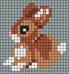 a cross stitch pattern with a dog's face