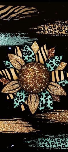 an animal print sunflower with gold glitters on it's center and zebra stripes in the background