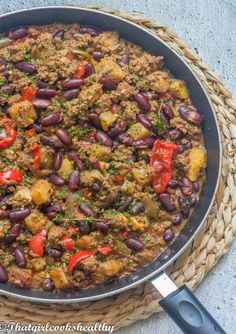 a skillet filled with beans and meat