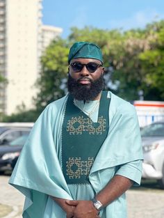 Elevate your style with our Custom-Made Men's Agbada Set - a perfect blend of tradition and modern elegance. This stunning Agbada features a rich teal color with intricate embroidery on the chest panel, reflecting the craftsmanship and attention to detail that goes into every piece. The design is tailored for a relaxed yet sophisticated fit, ideal for special occasions or cultural events. Key Features: *Material: Premium-quality fabric for a luxurious feel and long-lasting wear. *Color: Availabl Agbada Lace, Elegant Blue Ceremonial Agbada, Green Agbada, Luxury Blue Men's Agbada, Agbada Embroidery Designs For Men, Luxury Blue Traditional Agbada, Elegant Fitted Embroidered Agbada, Blue Agbada With Dabka Detail, Agbada Styles Men