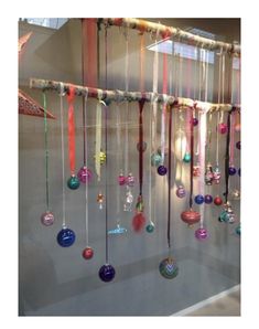 an assortment of ornaments hanging on a wall