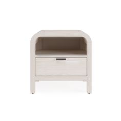 the side table has an open drawer on it and is made out of white wood