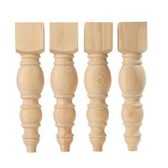 four wooden dowels are lined up on a white background