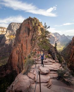 a person standing on the edge of a cliff