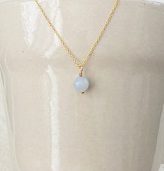 This is a classic and dainty aquamarine pendant necklace on an 18k gold finish chain over 925 sterling silver. Aquamarine represents happiness, hope and everlasting youth. Each order comes in a gift box and jewelry pouch, making it the perfect gift. *Please note, natural gemstones have slight variations so each piece will be unique and may vary slightly from what is pictured. This is handmade with love in my Gilbert, Arizona studio. Necklace Details: Finish: 18K Gold Material: Solid 925 Sterling Silver Chain Length: 17 inches + 2 inch extender Closure: Lobster clasp Gemstone: Aquamarine  Gemstone Size: 0.31 inches Pendant Dangle Length: 0.50 inches  Hypoallergenic  💎Care Instructions💎 - Do not Sleep, Sweat, Swim, Spray & Shower in your jewelry - Clean items with a soft cloth. - Do not us March Birthstone Necklace, Pouch Making, Gilbert Arizona, 18k Gold Necklace, Aquamarine Pendant, Aquamarine Necklace, March Birthstone, Aquamarine Gemstone, 925 Sterling Silver Chain