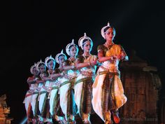 a group of people standing on top of a stage