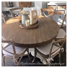 a wooden table with chairs around it