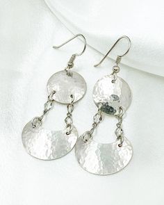 Simple and elegant, these shiny silver dangles were hand crafted from quality sterling silver sheet metal. These earrings feature silver discs at the top that are attached by chains to silver half moons below. The discs and half moons are slightly domed with a hammered texture to add sparkle. They are then polished to a mirror finish. The sterling silver ear wires feature a silver ball and coiled wire.  These silver dangle earrings are 2 1/4 inches long. They are lightweight and perfect for everyday or evening wear! They arrive gift boxed, ready for gifting yourself or a friend. Half Moons, Dangle Earrings Silver, Disc Earrings, Silver Tree, Silver Dangle Earrings, Tree Of Life Pendant, Broken Chain, Hammered Silver, Sheet Metal