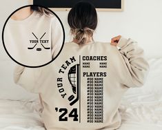 the back of a woman's sweatshirt with hockey team names and numbers on it