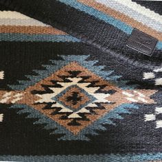 a close up view of a sweater with an interesting design