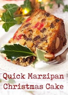 a piece of christmas cake on a white plate with holly leaves around it and the words quick marzipan christmas cake