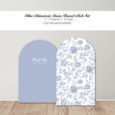 two blue and white paper cutouts with flowers on them, one is for a wedding card